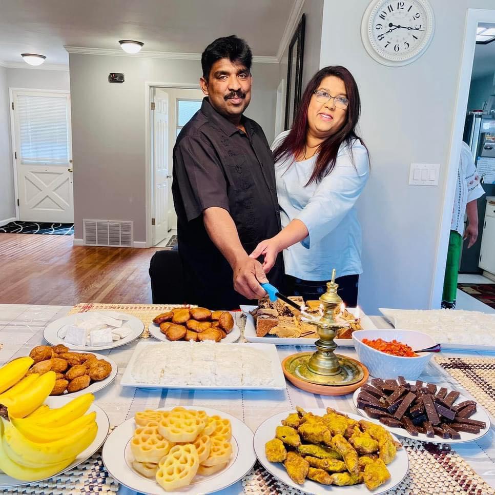 Sadana and Suneth celebrating with traditional Sri Lankan food